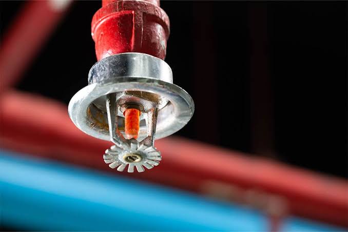 Overhead ceiling automatic fire sprinkler nozzle integrated into fire protection pipe network