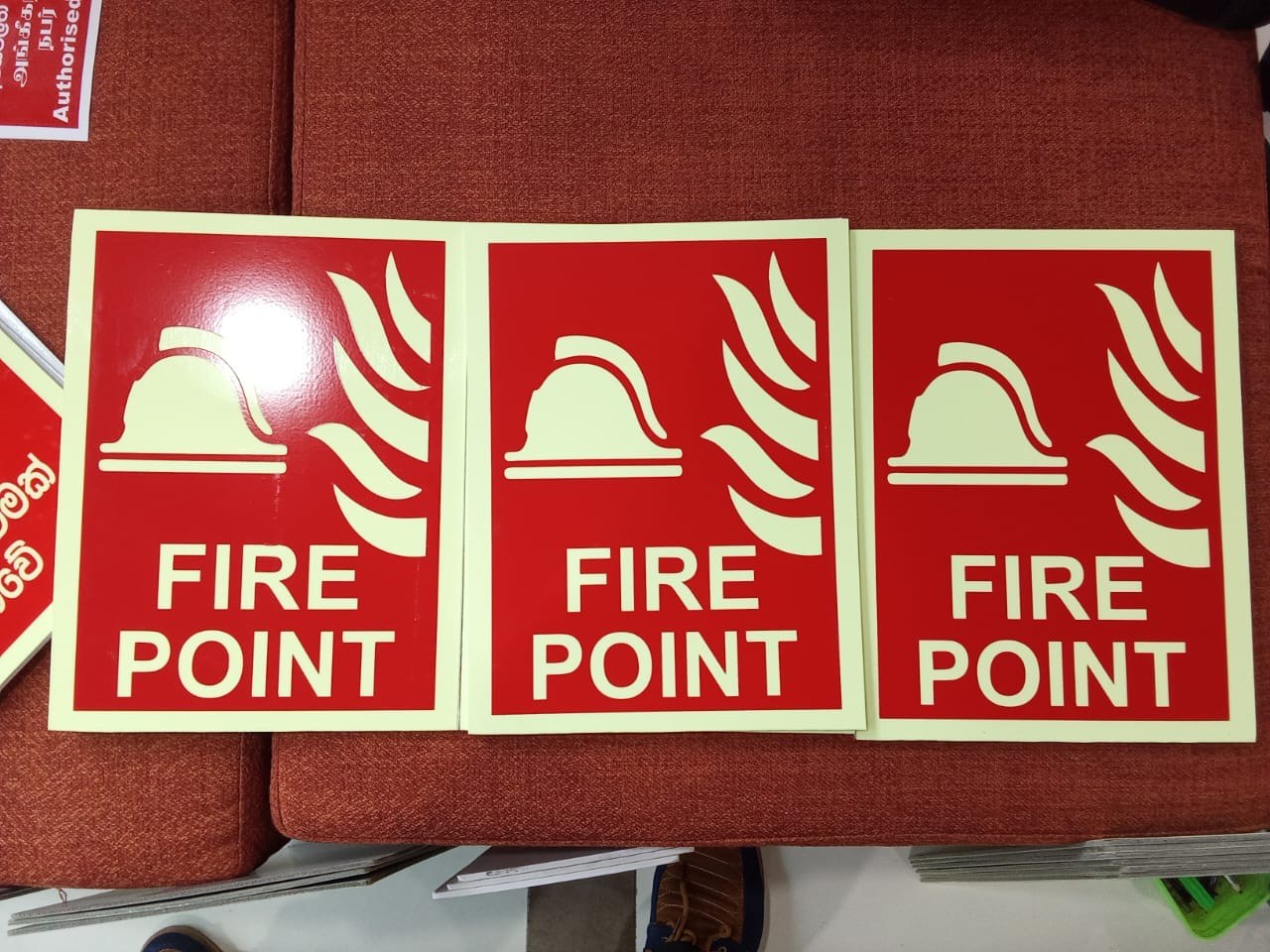 Red fire point background plates installed behind extinguisher cylinders