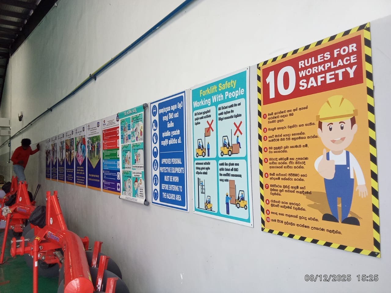 Comprehensive workplace safety compliance notice board mounted in industrial warehouse