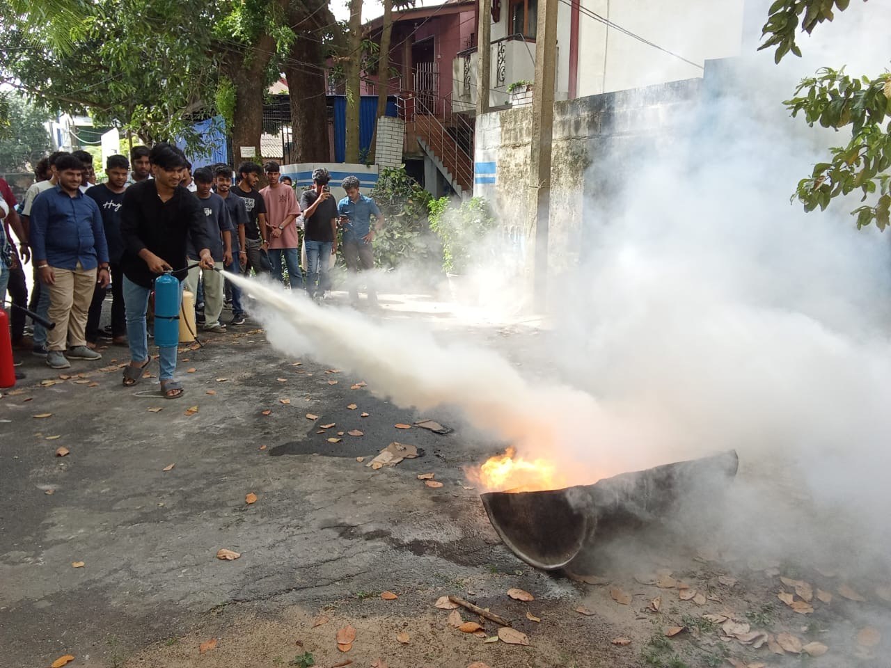 SAFE-X conducting practical live-fire extinguisher suppression drill with workplace team