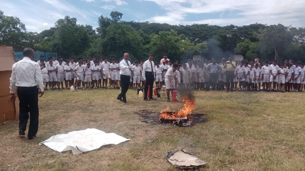 Students and faculty participating in live fire extinguisher awareness drill